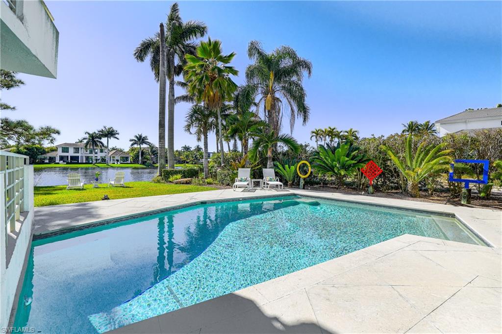 536 Turtle Hatch Road Naples, FL 34103 - Photo 3 of 28 Swimming pool with a patio and a water view