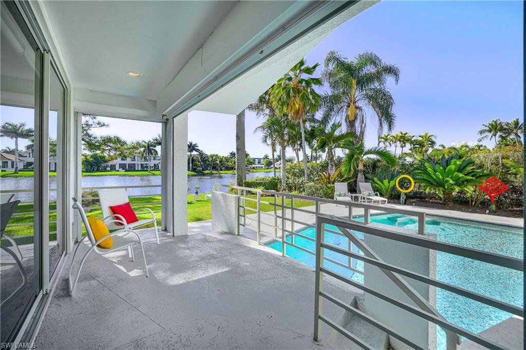 536 Turtle Hatch Road Naples, FL 34103 - Photo 8 of 28 Outdoor pool featuring a patio and a water view