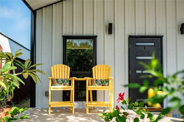 a view of swimming pool from a outdoor seating