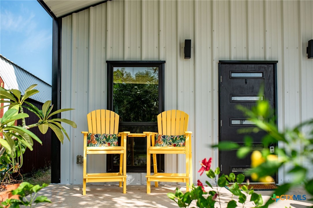 804 Tyler Avenue Port O'Connor, TX 77982 - Photo 2 of 43 a view of swimming pool from a outdoor seating
