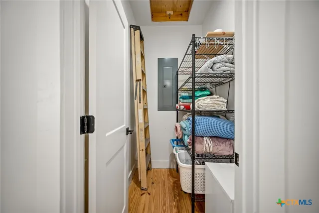 a view of walk in closet with clothes