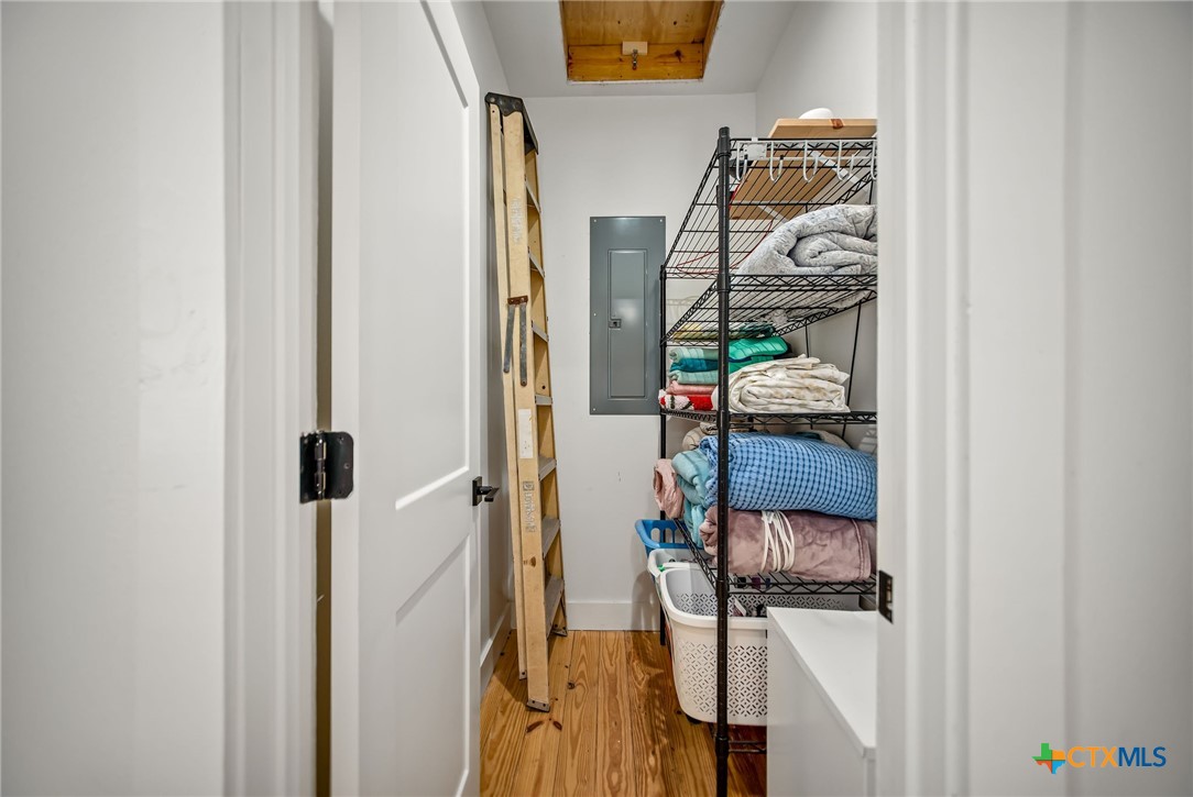 804 Tyler Avenue Port O'Connor, TX 77982 - Photo 35 of 43 a view of walk in closet with clothes