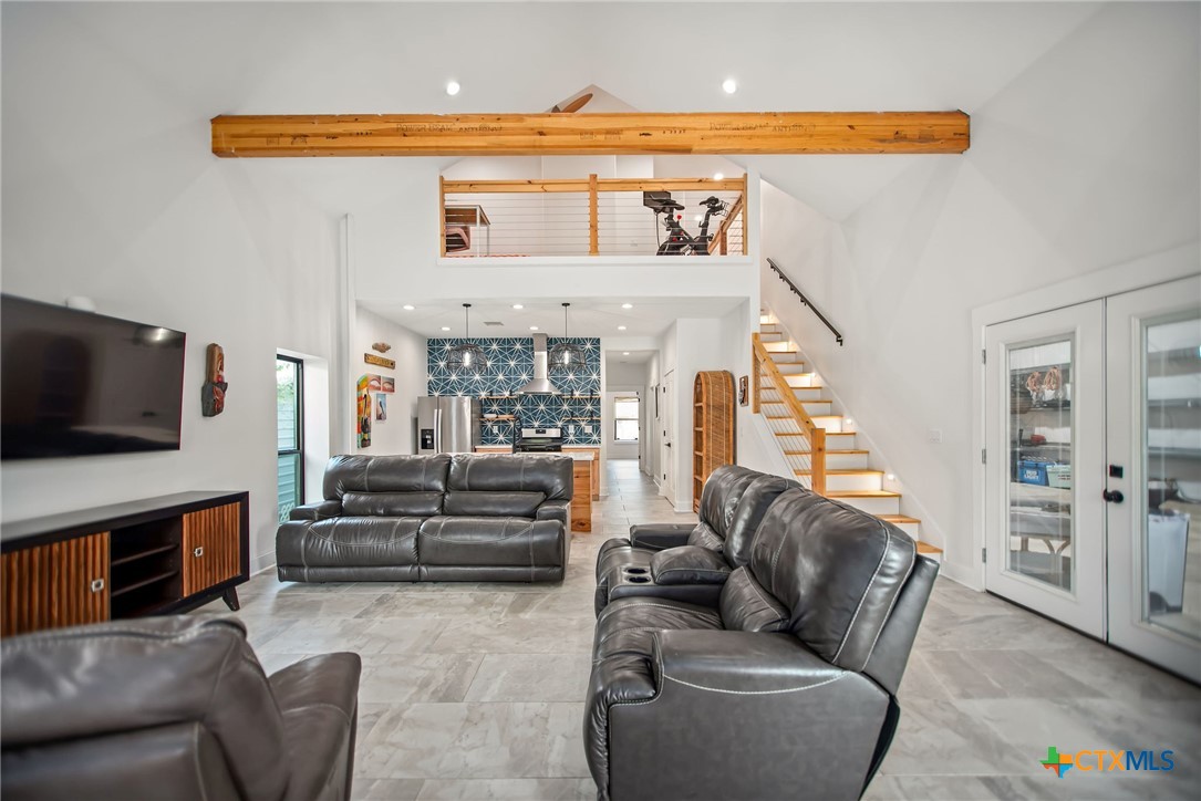 804 Tyler Avenue Port O'Connor, TX 77982 - Photo 8 of 43 a living room with furniture and a flat screen tv