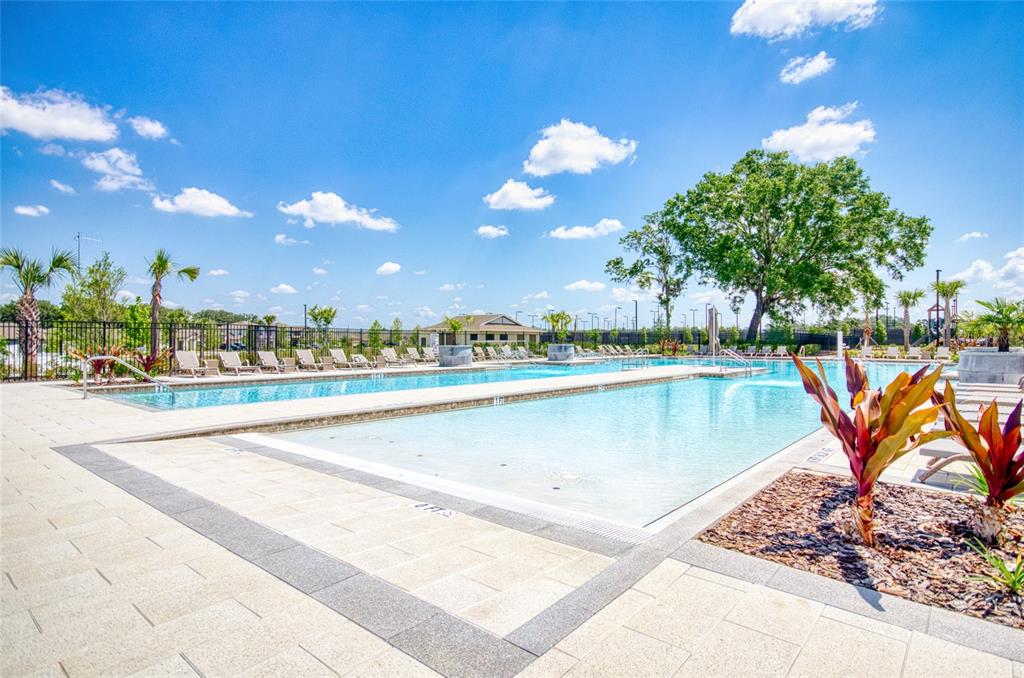 6736 Ripple Pond Loop Zephyrhills, FL 33541 - Photo 35 of 40 a view of a swimming pool and an outdoor space