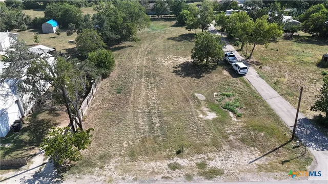 a view of a backyard of the house