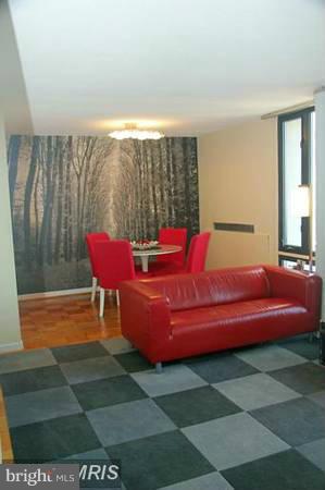 430 M Street Southwest, Unit N810 Washington, DC 20024 - Photo 3 of 18 a living room with furniture and a large window