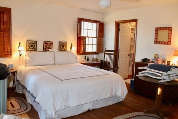 71 Bartimus Luce Road West Tisbury, MA 02568 - Photo 5 of 8 a bedroom with a bed and a window