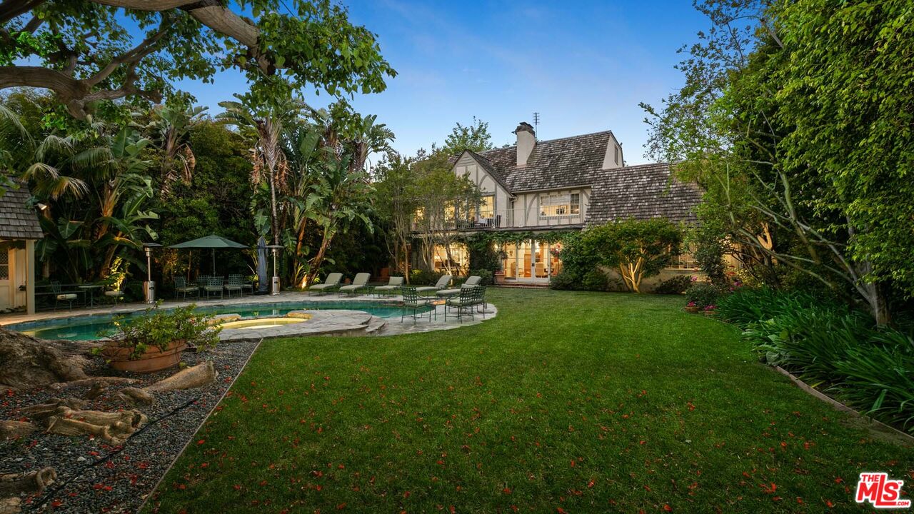 620 North Crescent Drive Beverly Hills, CA 90210 - Photo 1 of 23 a view of a table and chairs in the garden