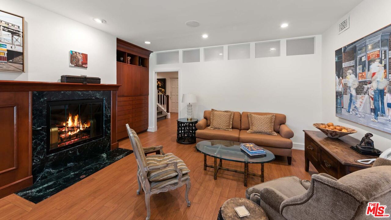 620 North Crescent Drive Beverly Hills, CA 90210 - Photo 15 of 23 a living room with furniture and a fireplace