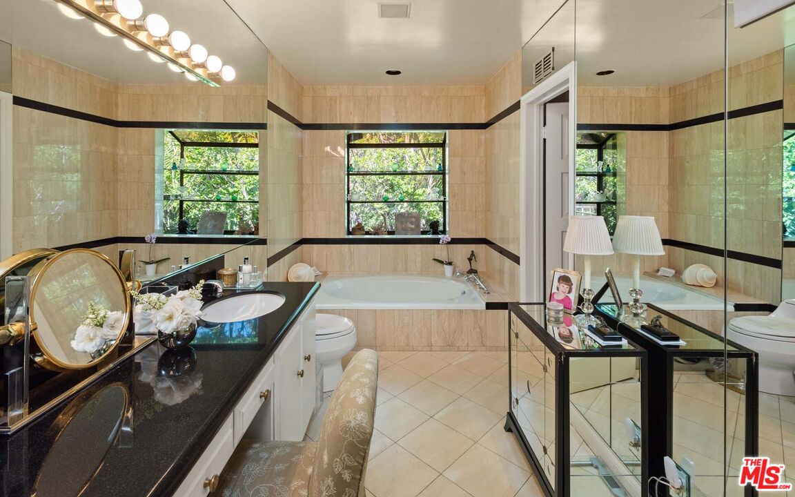 620 North Crescent Drive Beverly Hills, CA 90210 - Photo 18 of 23 a large white kitchen with a large window