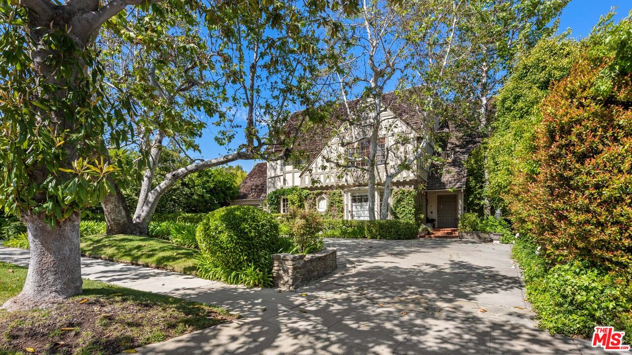 620 North Crescent Drive Beverly Hills, CA 90210 - Photo 2 of 23 a front view of a house with a yard