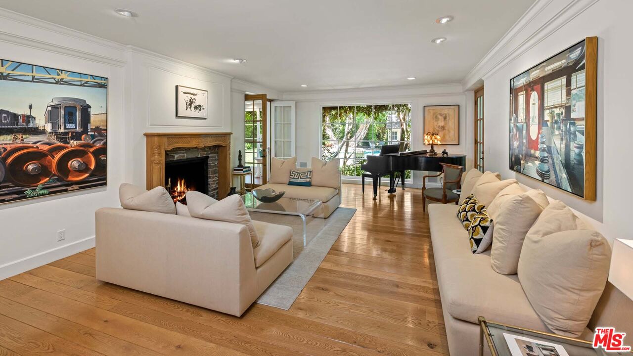 620 North Crescent Drive Beverly Hills, CA 90210 - Photo 3 of 23 a living room with furniture and a fireplace