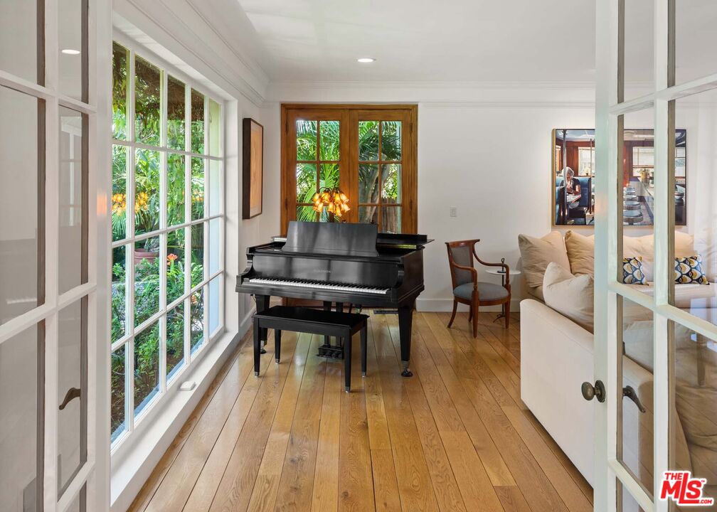 620 North Crescent Drive Beverly Hills, CA 90210 - Photo 9 of 23 a living room with furniture and a wooden floor