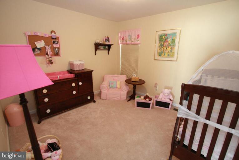 14418 Autumn Crest Road Boyds, MD 20841 - Photo 2 of 26 a bedroom with furniture and a window