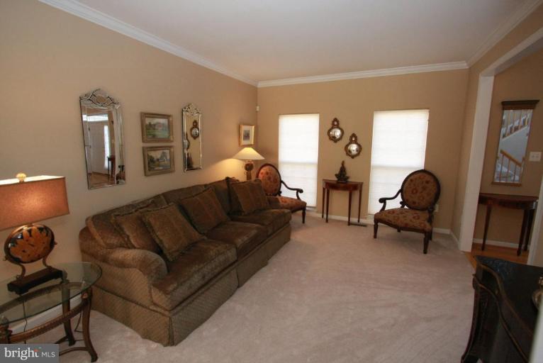 14418 Autumn Crest Road Boyds, MD 20841 - Photo 17 of 26 a living room with furniture and a lamp