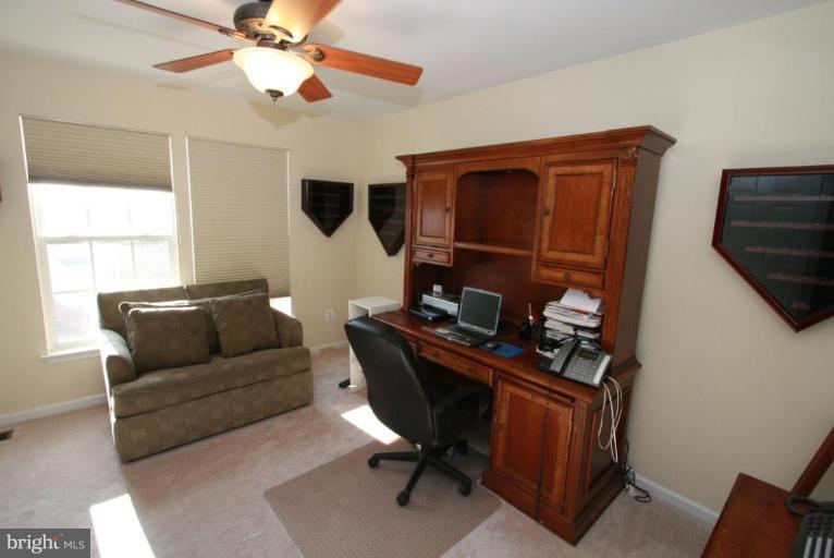 14418 Autumn Crest Road Boyds, MD 20841 - Photo 3 of 26 a living room with furniture and a window