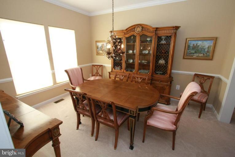 14418 Autumn Crest Road Boyds, MD 20841 - Photo 7 of 26 a view of a dining room with furniture window and outside view