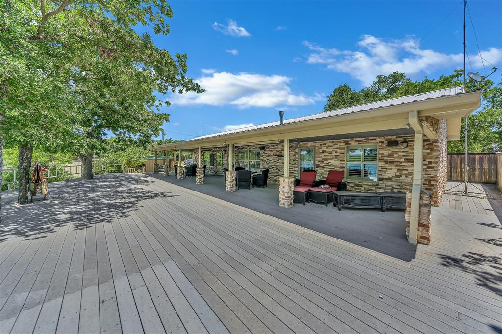 566 Selma Park Road Bowie, TX 76230 - Photo 23 of 40 Expansive outdoor deck featuring wood-finish flooring