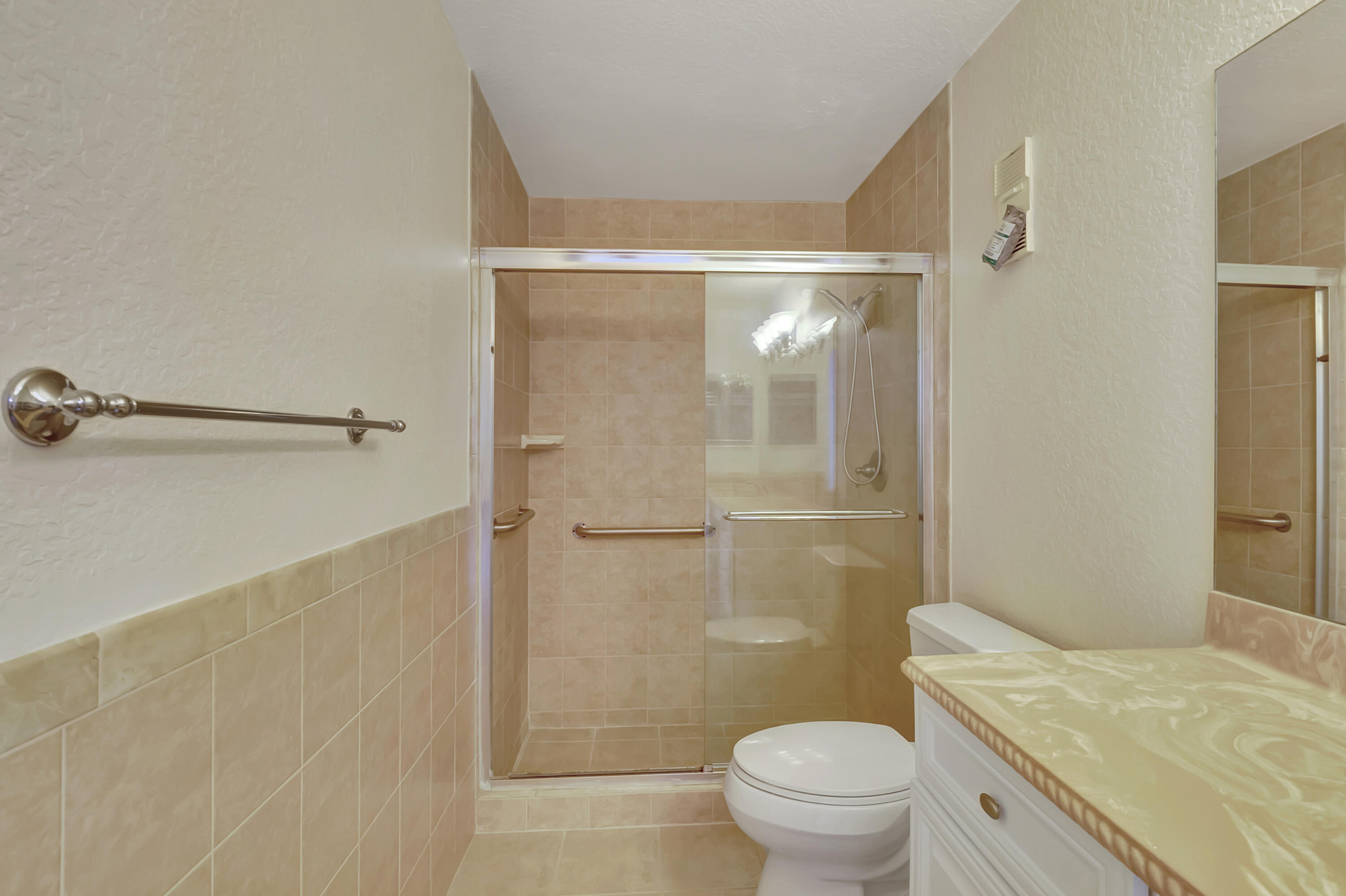18559 Breezy Palm Way Boca Raton, FL 33496 - Photo 24 of 43 a bathroom with a granite countertop sink toilet and shower