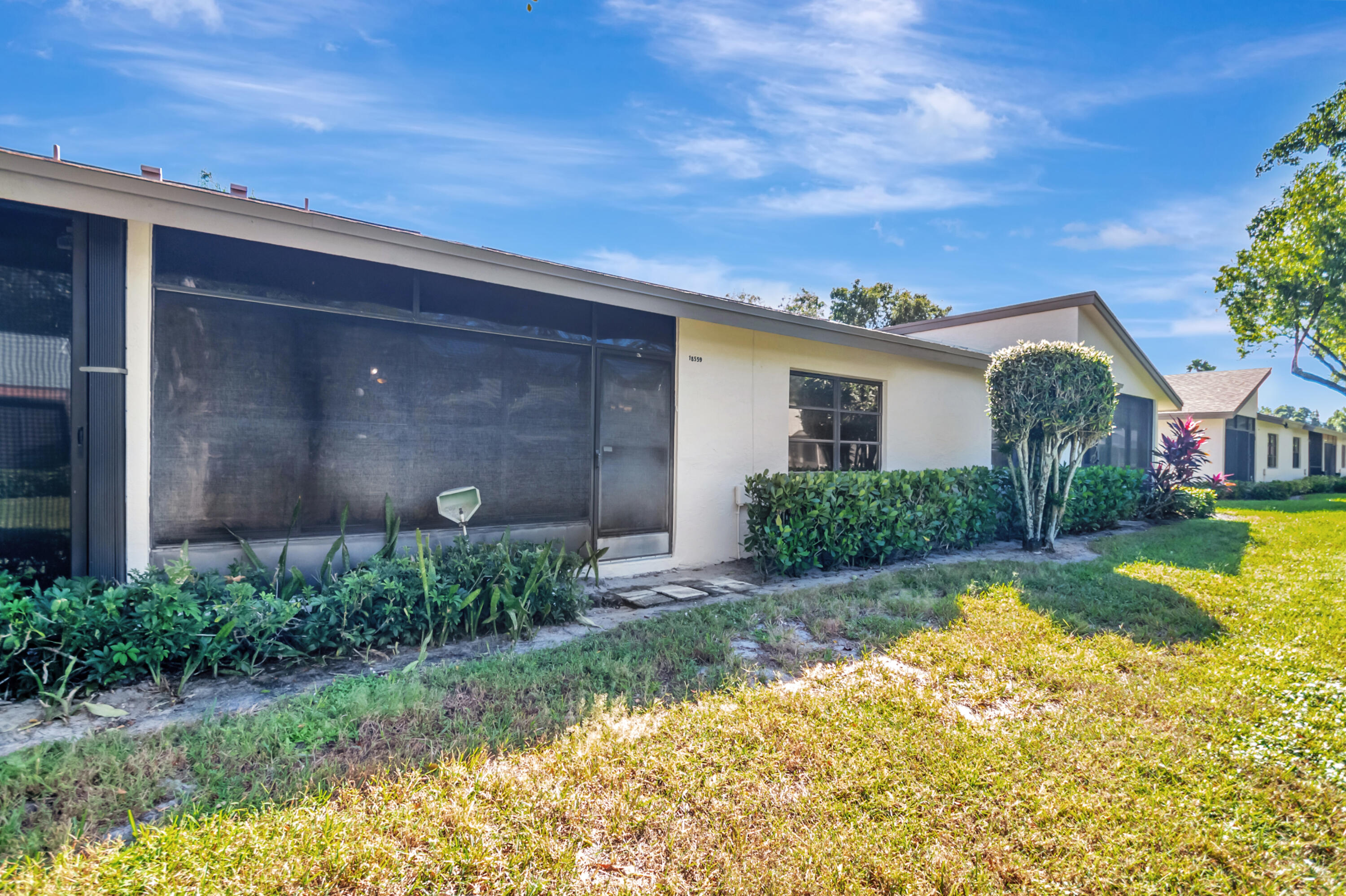 18559 Breezy Palm Way Boca Raton, FL 33496 - Photo 34 of 43 a front view of house with yard and green space