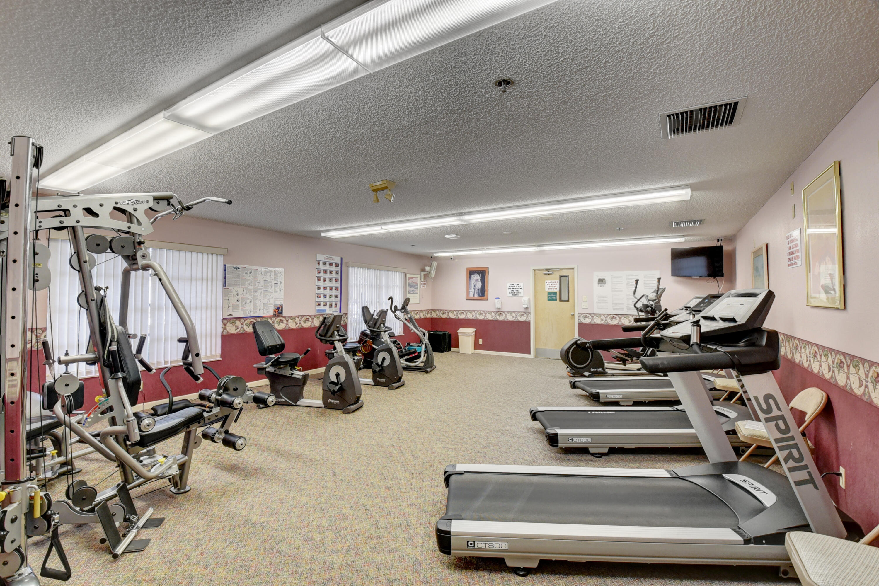 18559 Breezy Palm Way Boca Raton, FL 33496 - Photo 39 of 43 a view of a room with gym equipment