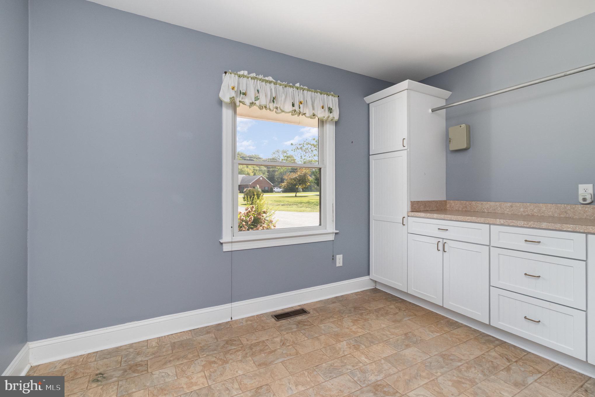 687 Prospect Hill Road Montross, VA 22520 - Photo 40 of 73 laundry room with ample shelves for folding