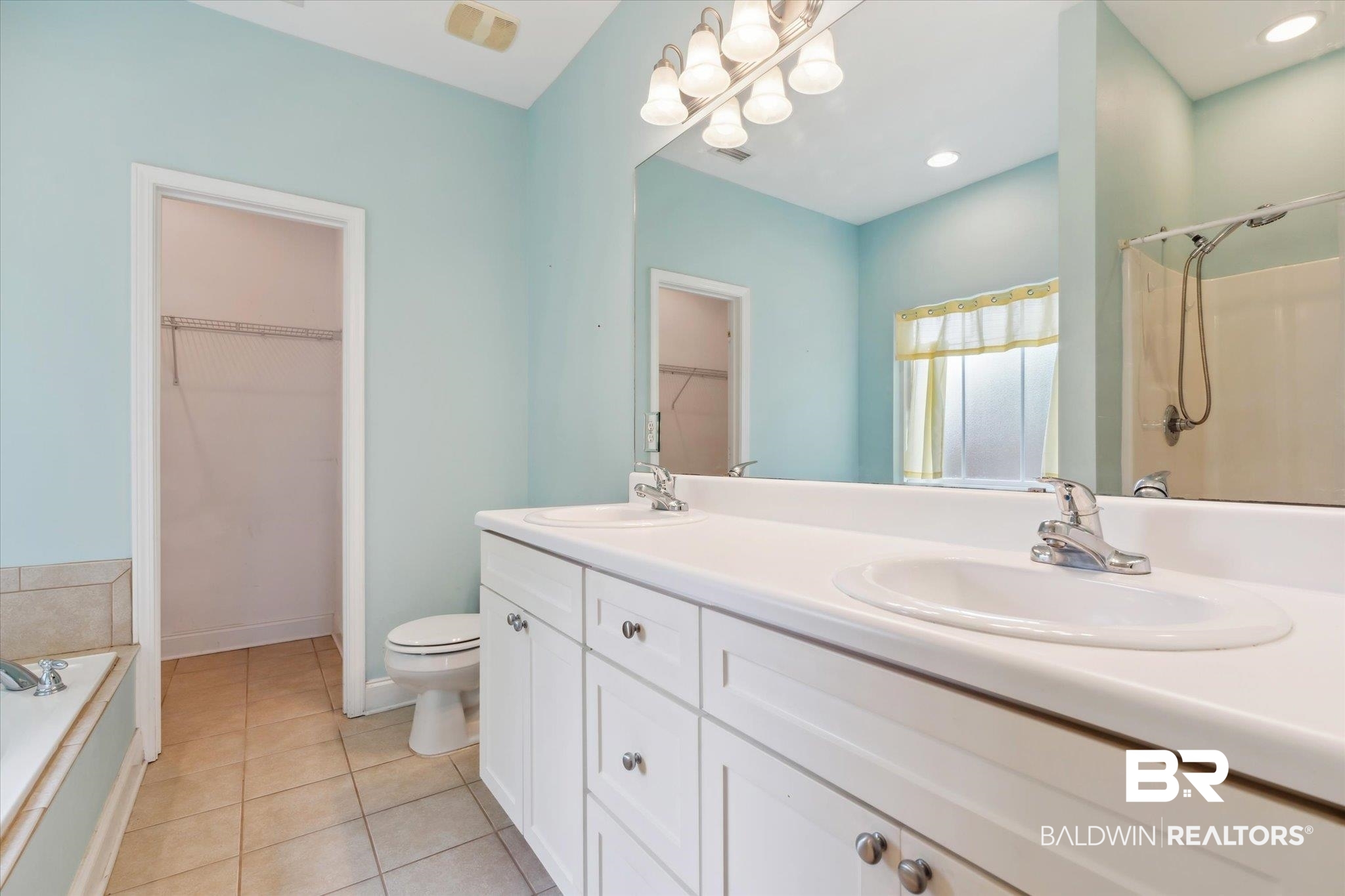17297 Tallasee Boulevard Foley, AL 36535 - Photo 13 of 24 Bathroom featuring toilet, a bathtub, double sink vanity, and tile patterned flooring