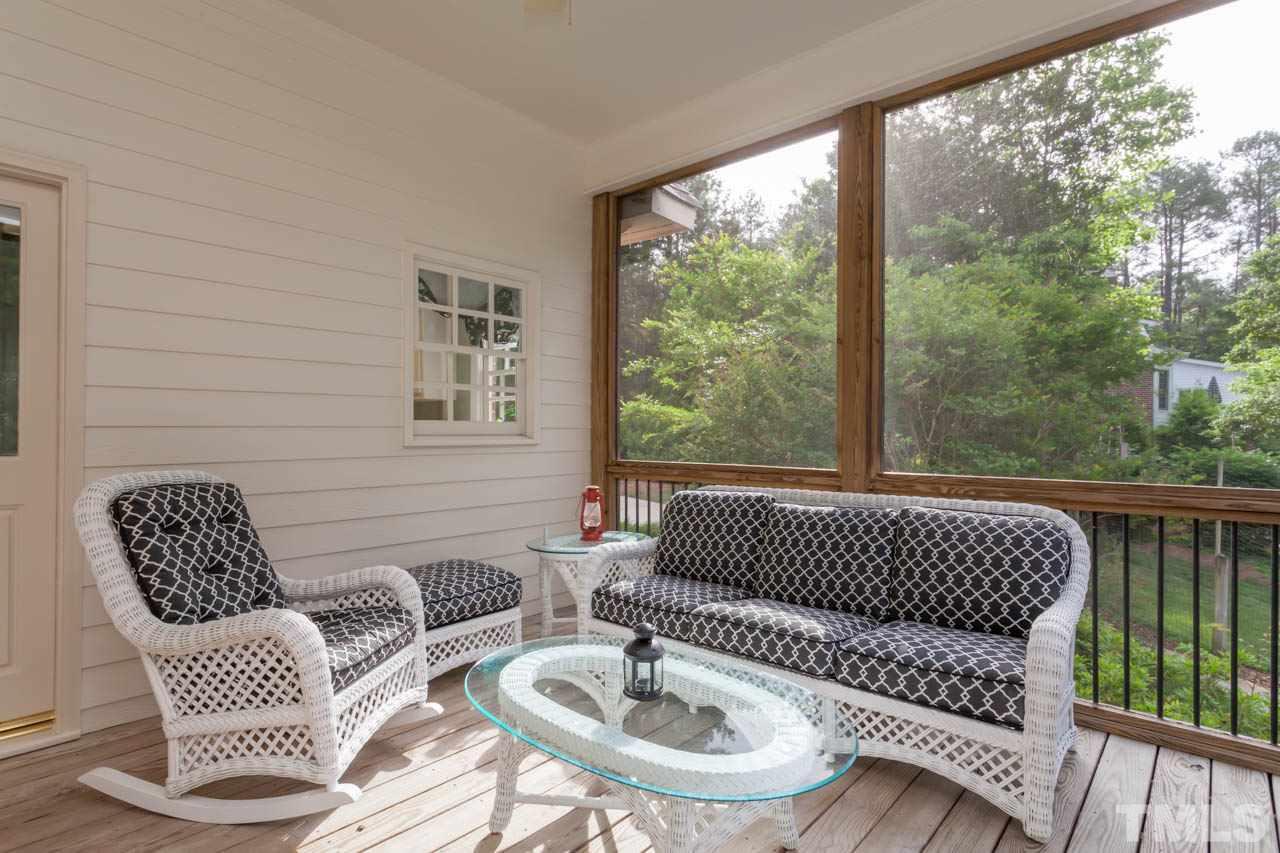 13921 Possum Track Road Raleigh, NC 27614 - Photo 16 of 25 Enjoy beautiful NC afternoons on this cozy screened porch.
