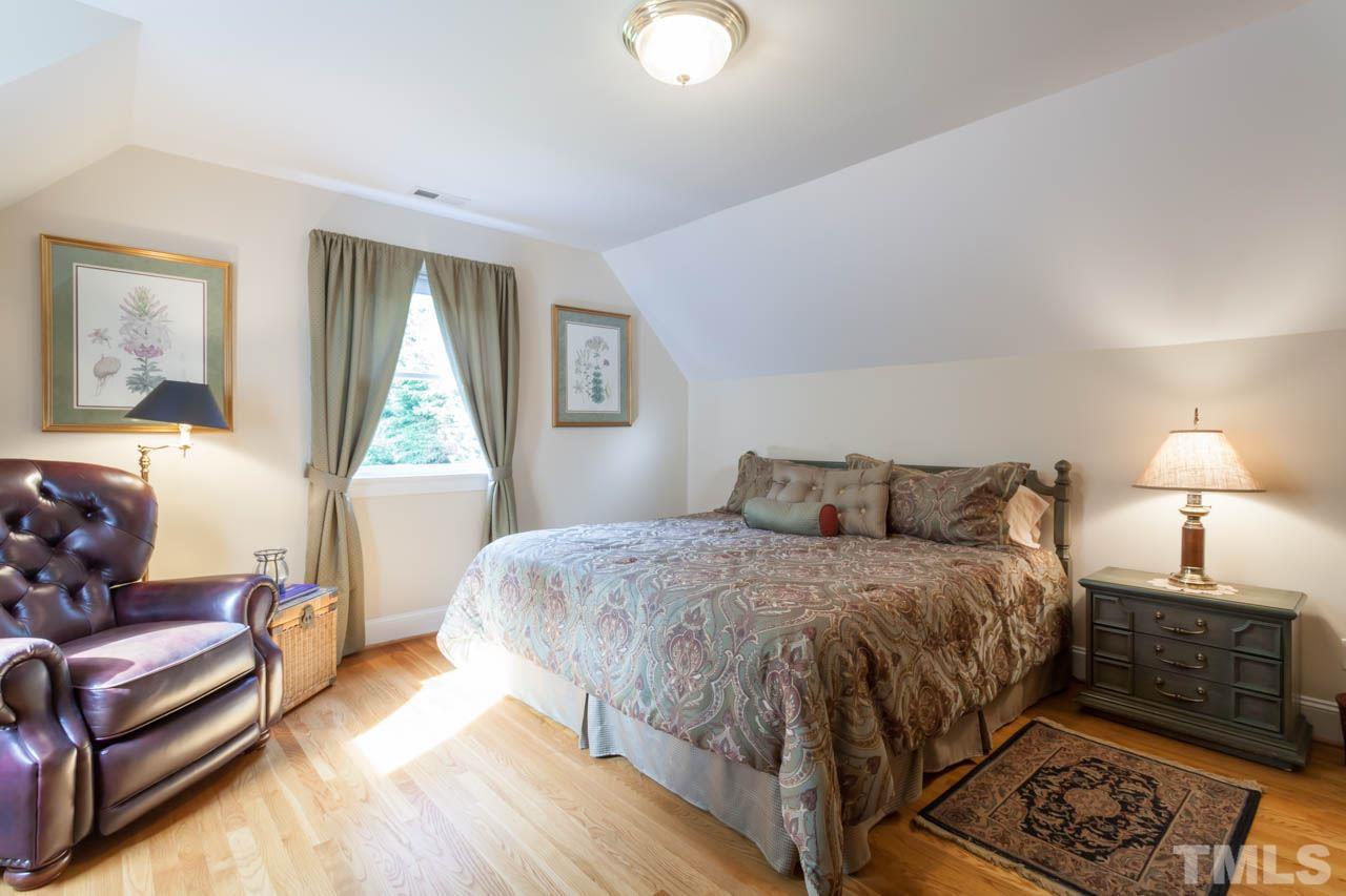 13921 Possum Track Road Raleigh, NC 27614 - Photo 21 of 25 Large and spacious secondary bedroom. Beautiful hardwood finishes throughout.