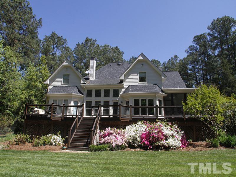 13921 Possum Track Road Raleigh, NC 27614 - Photo 4 of 25 Exquisite view of the rear of the home with deck and screened porch.