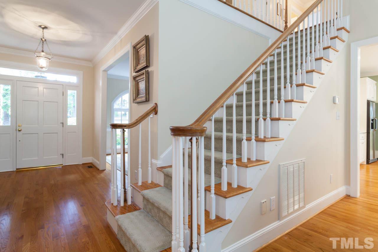 13921 Possum Track Road Raleigh, NC 27614 - Photo 7 of 25 Beautiful view of the staircase leading to the second floor and additional bedrooms and bonus area.