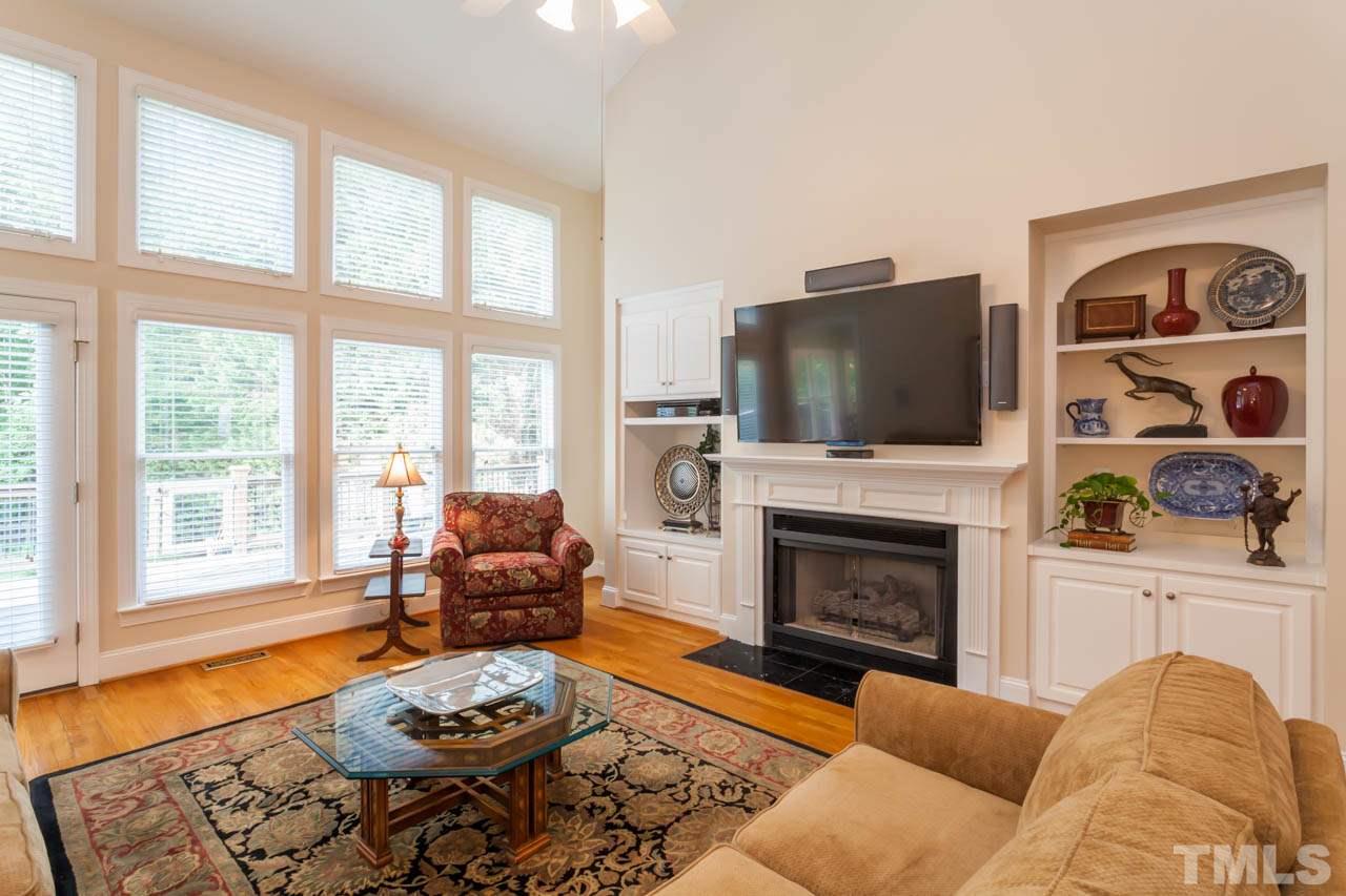 13921 Possum Track Road Raleigh, NC 27614 - Photo 10 of 25 Look at the all the natural light shining in! Large and spacious Family Room, great for entertaining. Beautiful fireplace and surround with built-in bookshelves.