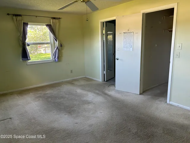 an empty room that has a window