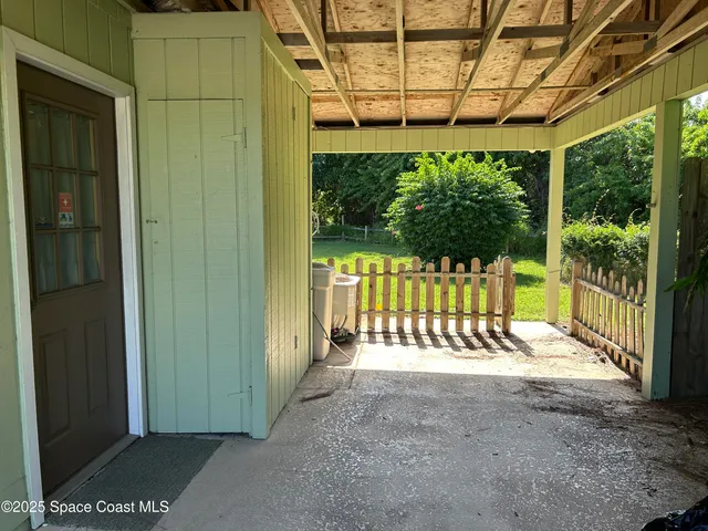 a view of a porch with a backyard