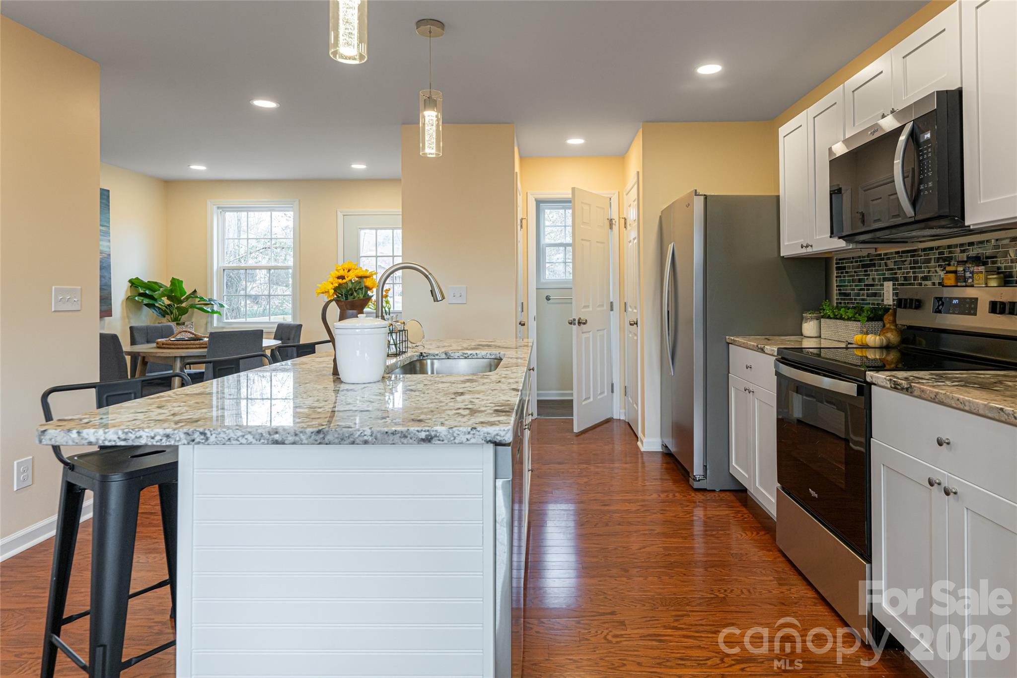 622 North Main Street Canton, NC 28716 - Photo 13 of 36 a kitchen with stainless steel appliances granite countertop a sink a stove and a refrigerator