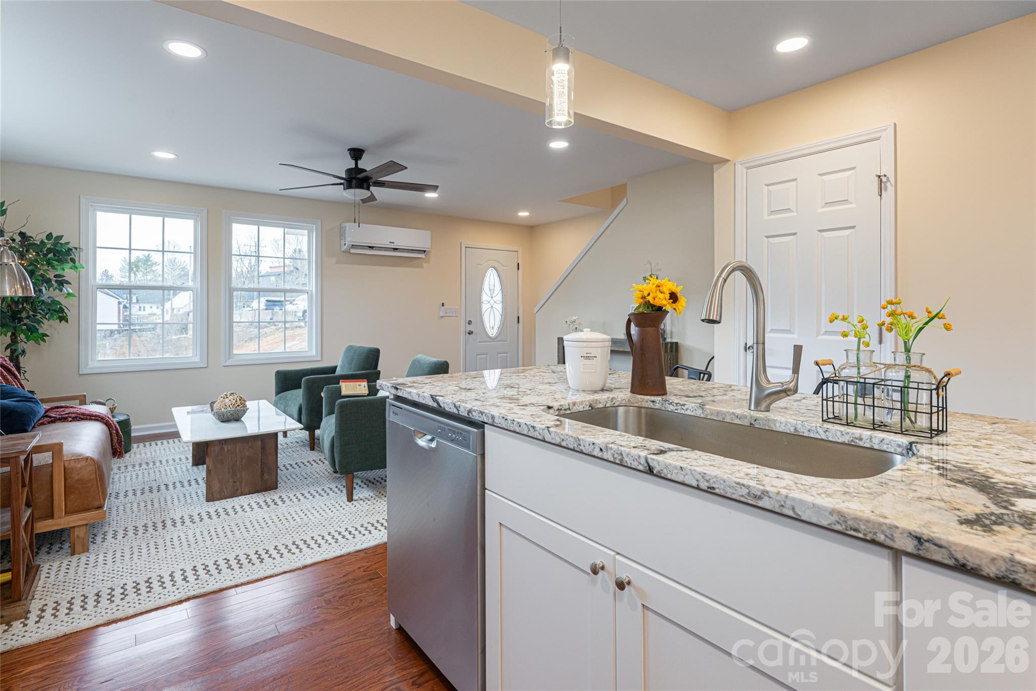 622 North Main Street Canton, NC 28716 - Photo 16 of 36 a kitchen with granite countertop a sink cabinets and wooden floor