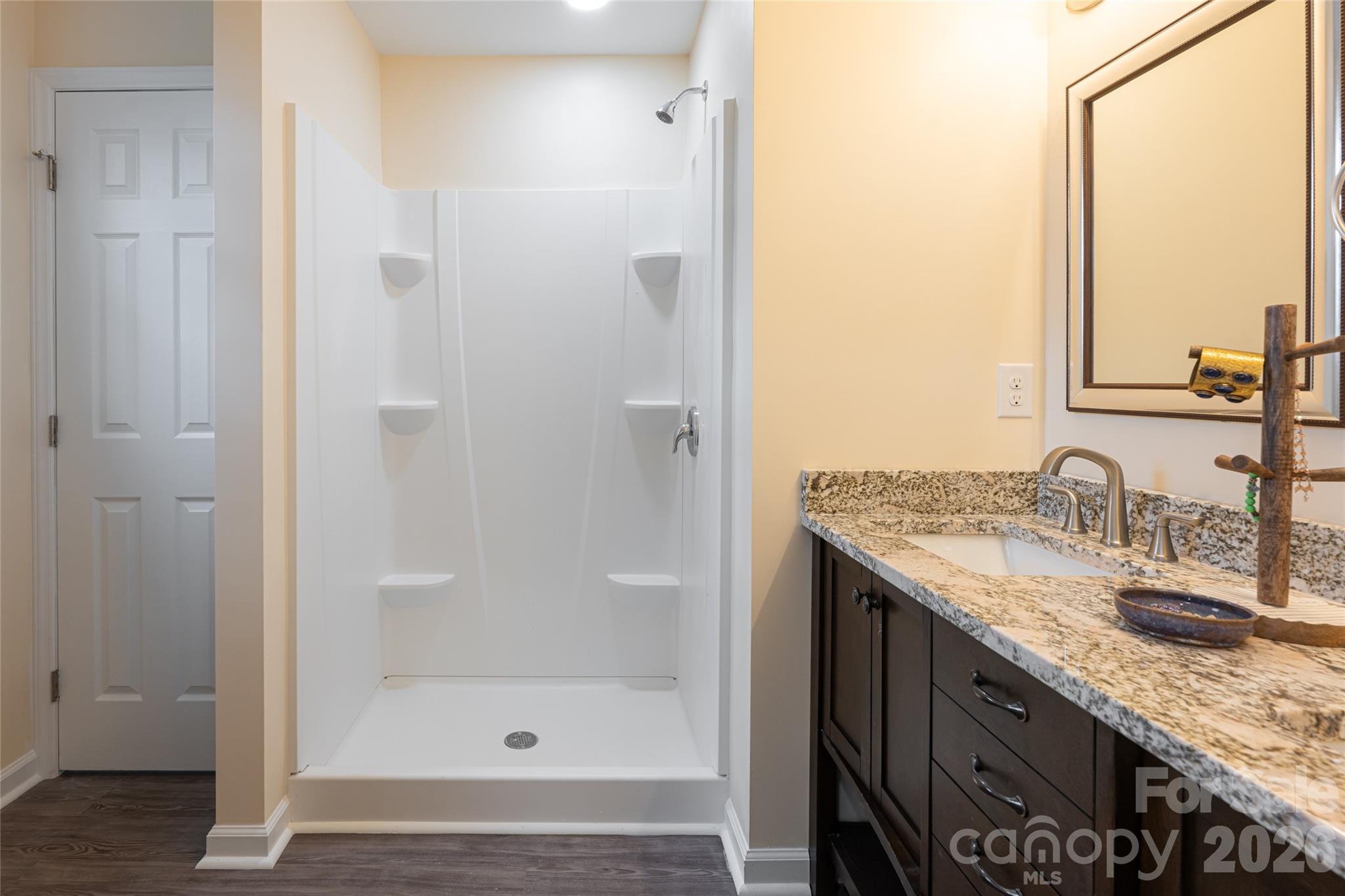622 North Main Street Canton, NC 28716 - Photo 24 of 36 a bathroom with a granite countertop sink and a mirror