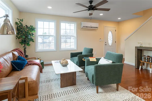a living room with furniture and a window
