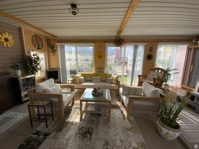 1061 Copper Street Stockton, UT 84071 - Photo 24 of 43 Enclosed sunroom featuring multiple sliding glass doors and transom windows