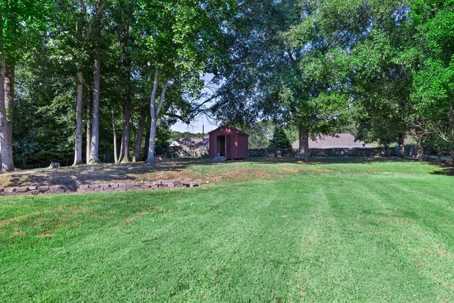 a view of swimming pool with a yard