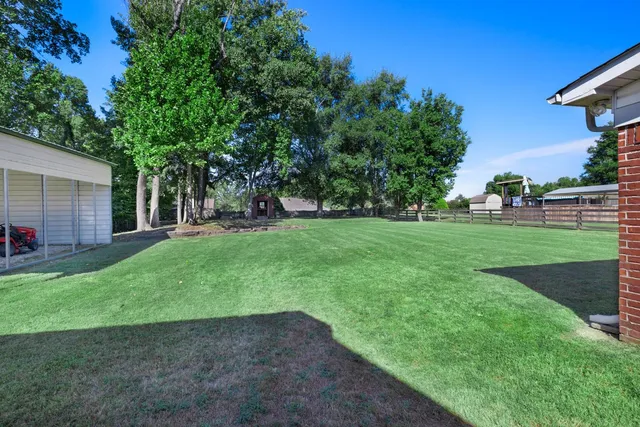 a view of a backyard with a garden