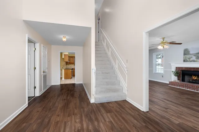 wooden floor in an empty room with a fireplace