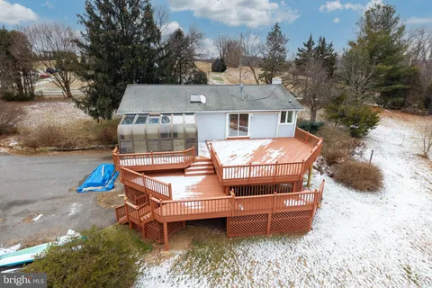 a view of a swimming pool with a roof deck