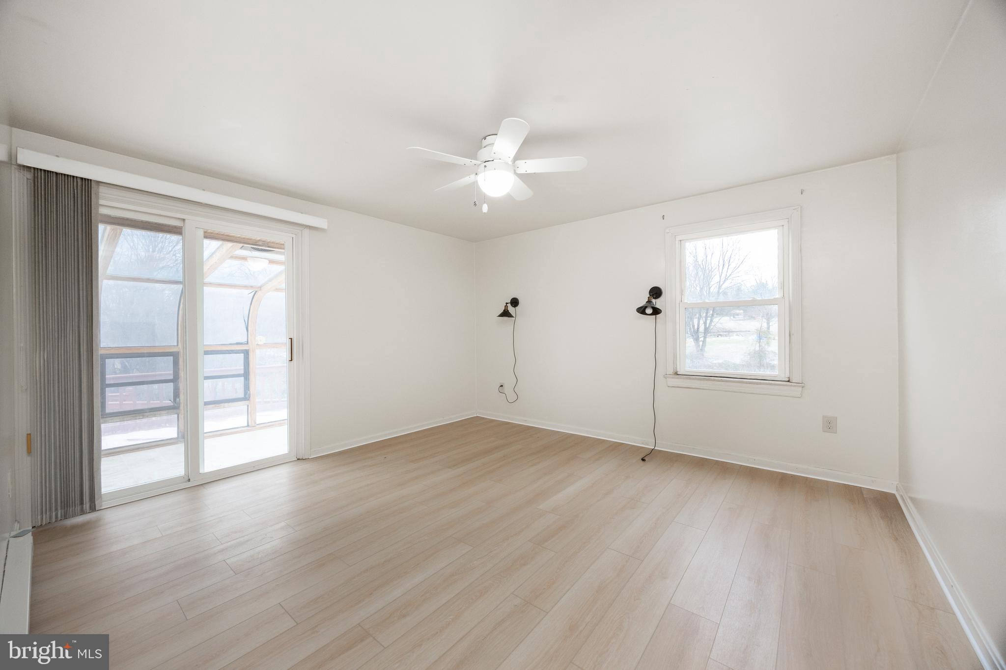 414 Reedville Road Oxford, PA 19363 - Photo 34 of 62 Primary Bedroom with sliders to solarium