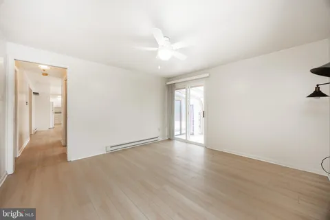 a view of empty room with a fireplace