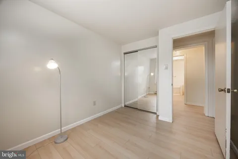a bathroom with a toilet sink and a mirror