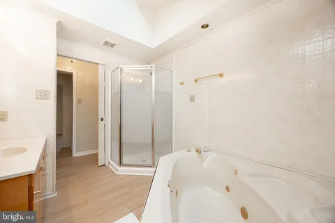 an empty room with white walls and windows