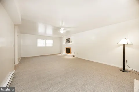 a view of an empty room with a balcony