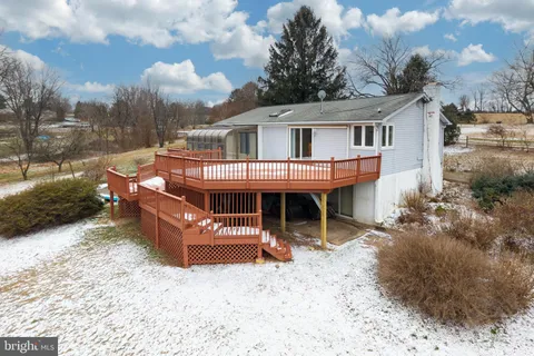 a view of a roof deck with wooden fence