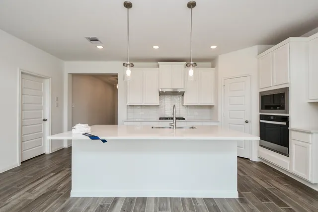 a bathroom with a sink and a bathtub